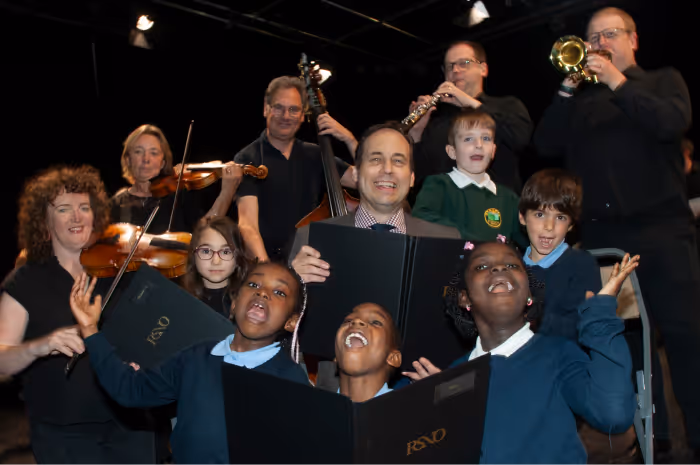 A picture of happy students and musicians holding instruments at the Lemon Tree.
